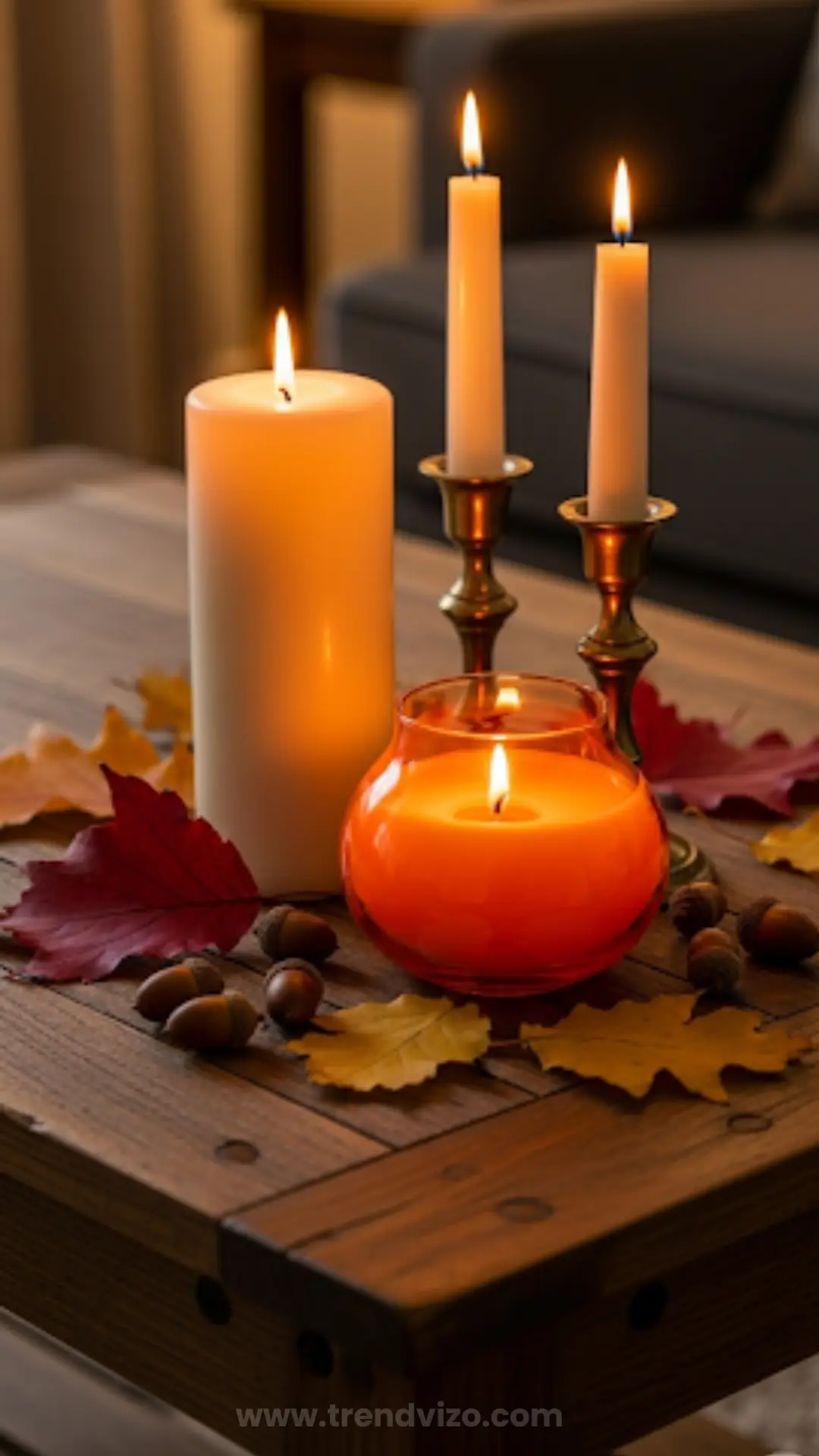 A warm autumn scene with lit candles on a rustic wooden table surrounded by vibrant red and yellow leaves, creating a cozy and inviting ambiance.